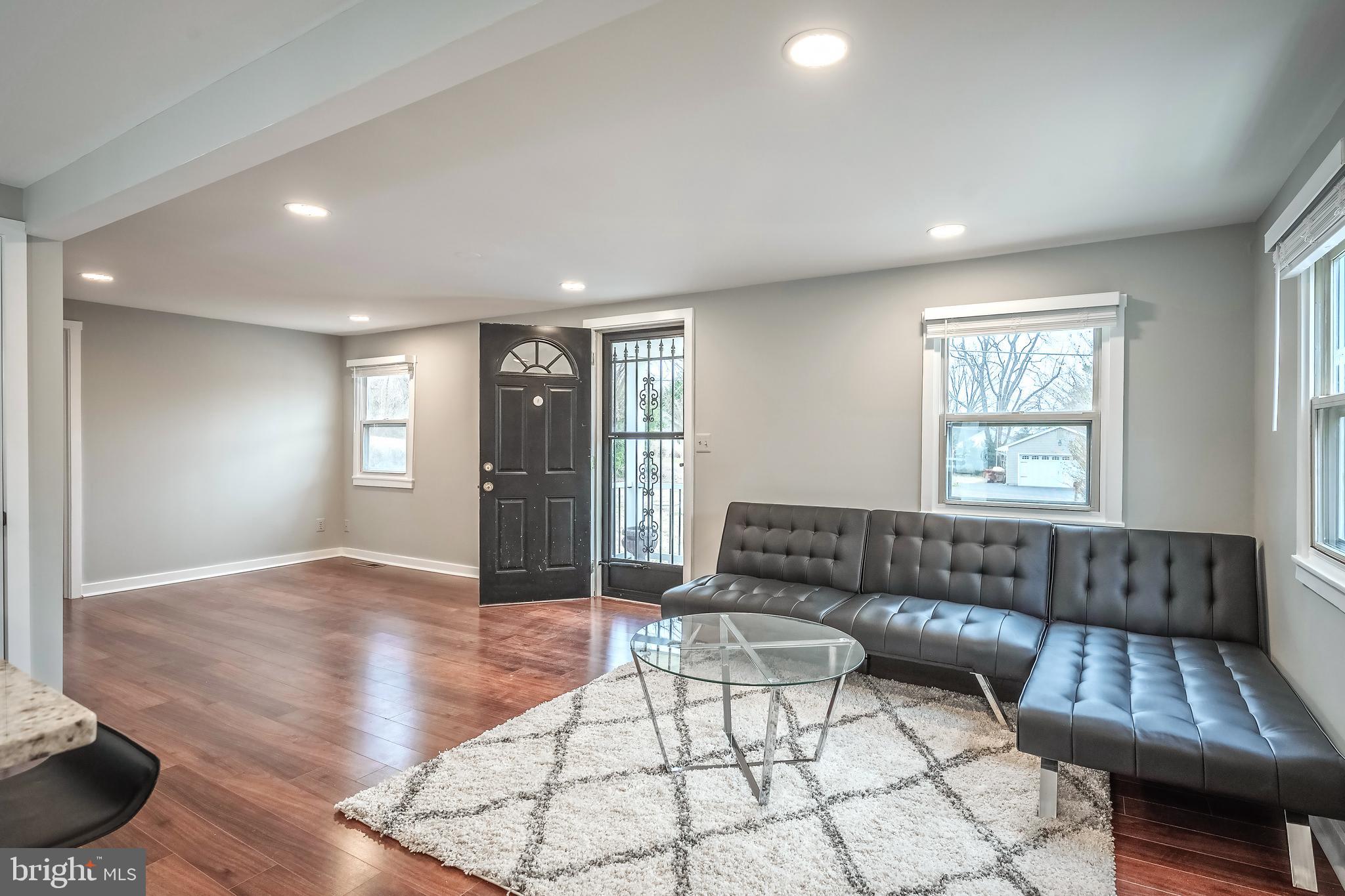 6946 Blantyre Road Warrenton, VA 20187 - Photo 2 of 24 a living room with furniture and a window