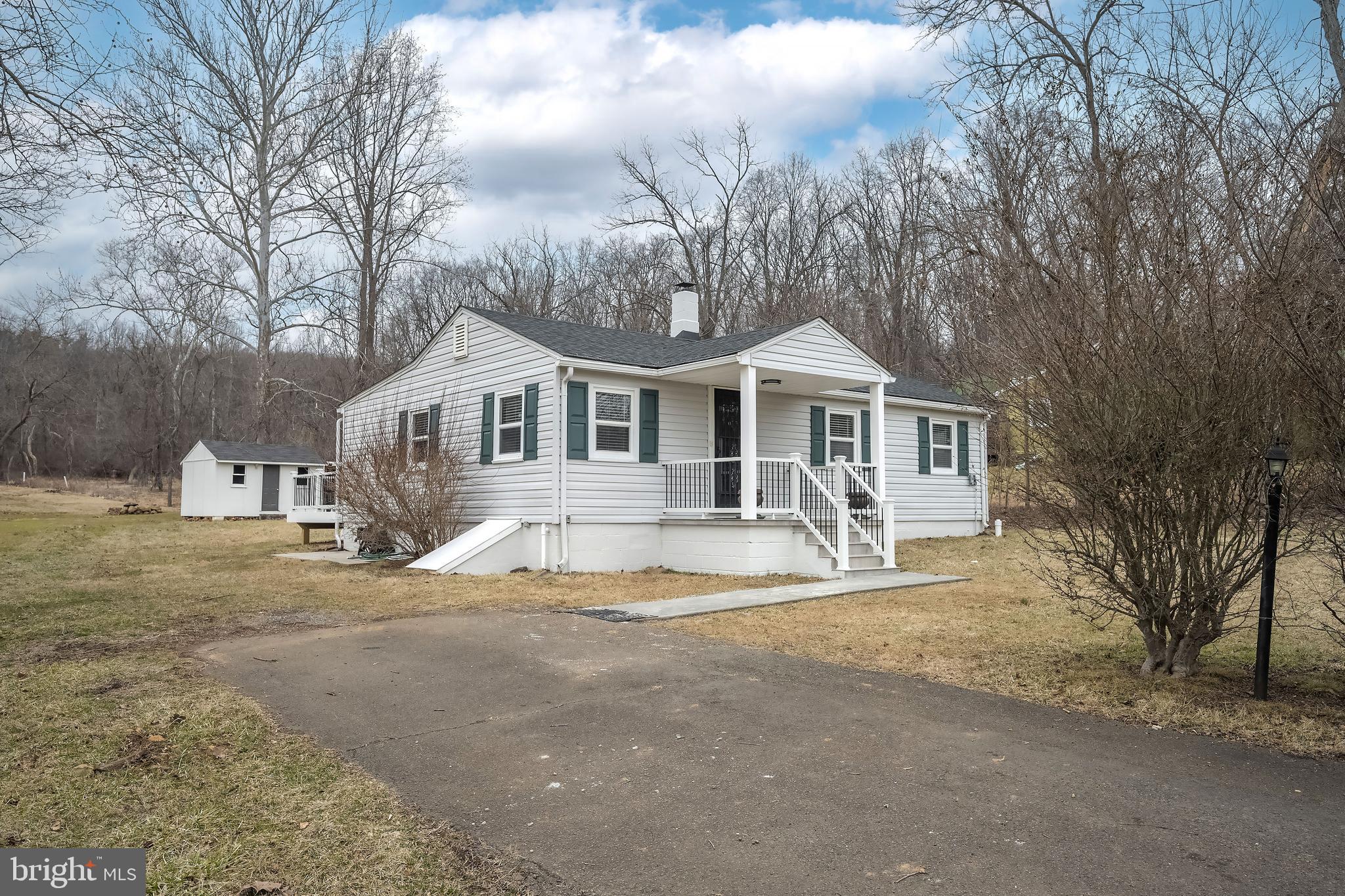 6946 Blantyre Road Warrenton, VA 20187 - Photo 22 of 24 a front view of a house with a yard
