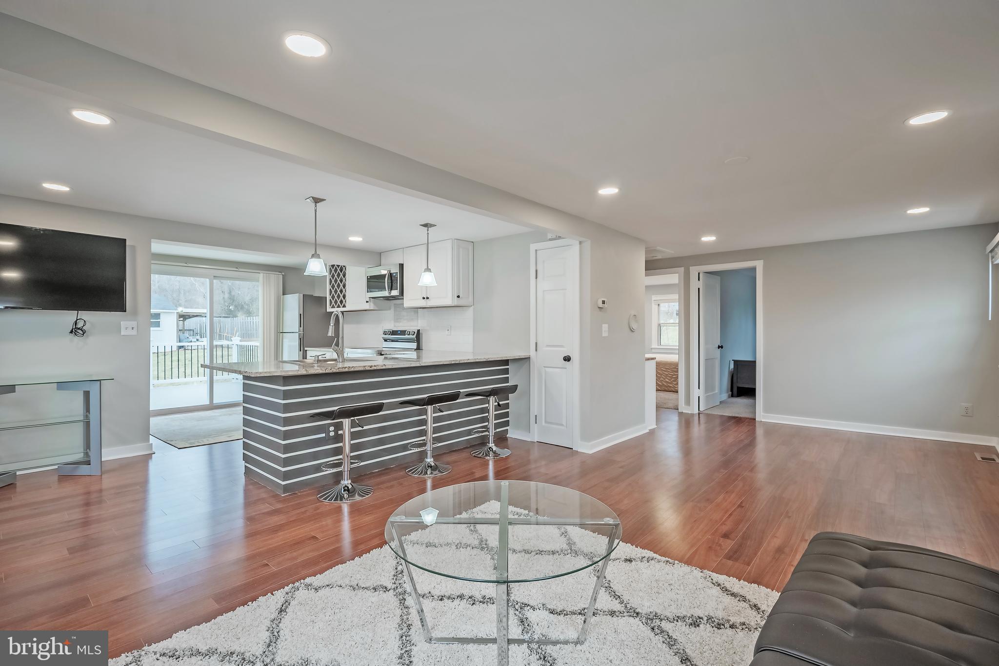 6946 Blantyre Road Warrenton, VA 20187 - Photo 3 of 24 a room with wooden floors and lots of appliances