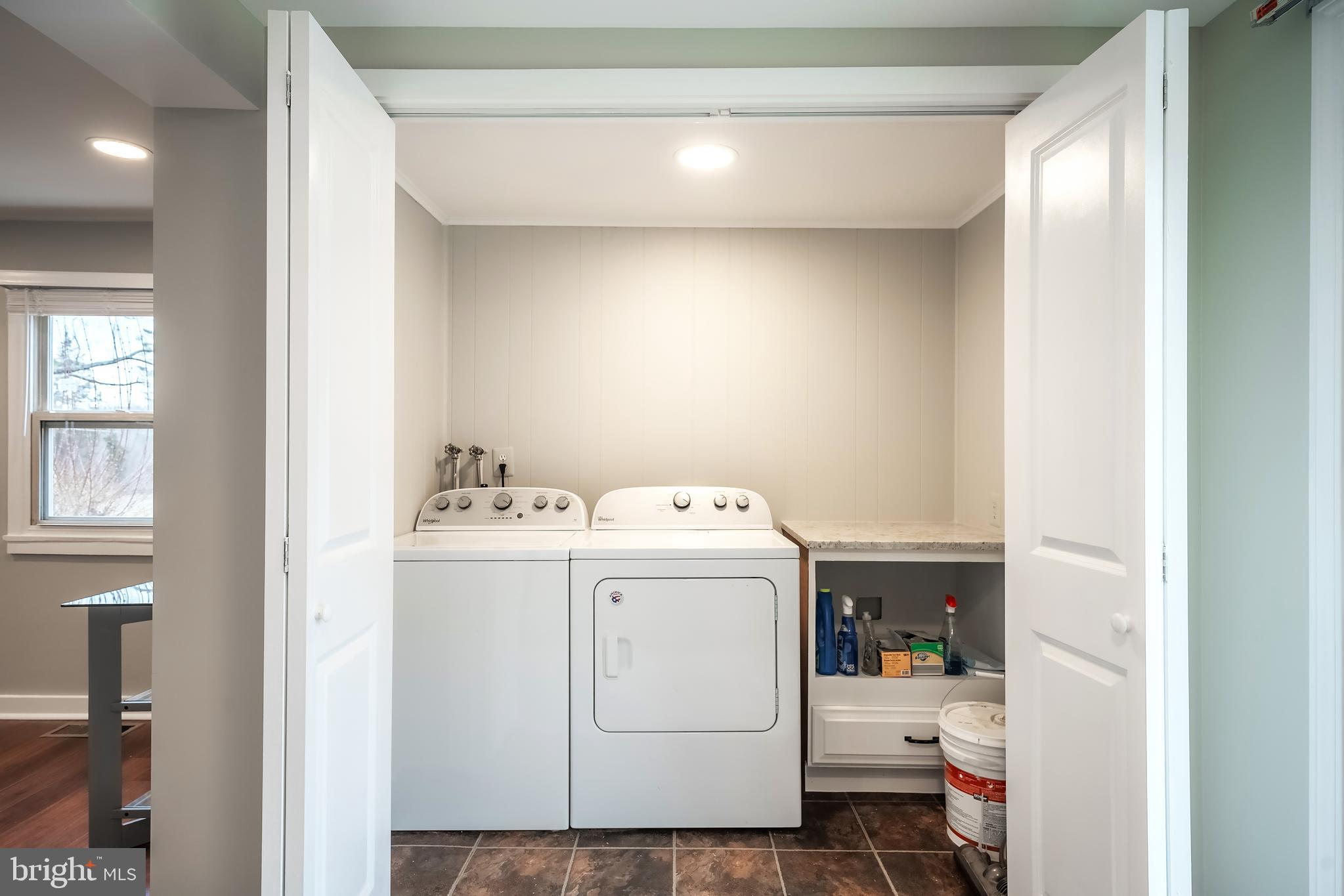 6946 Blantyre Road Warrenton, VA 20187 - Photo 9 of 24 a utility room with dryer and washer