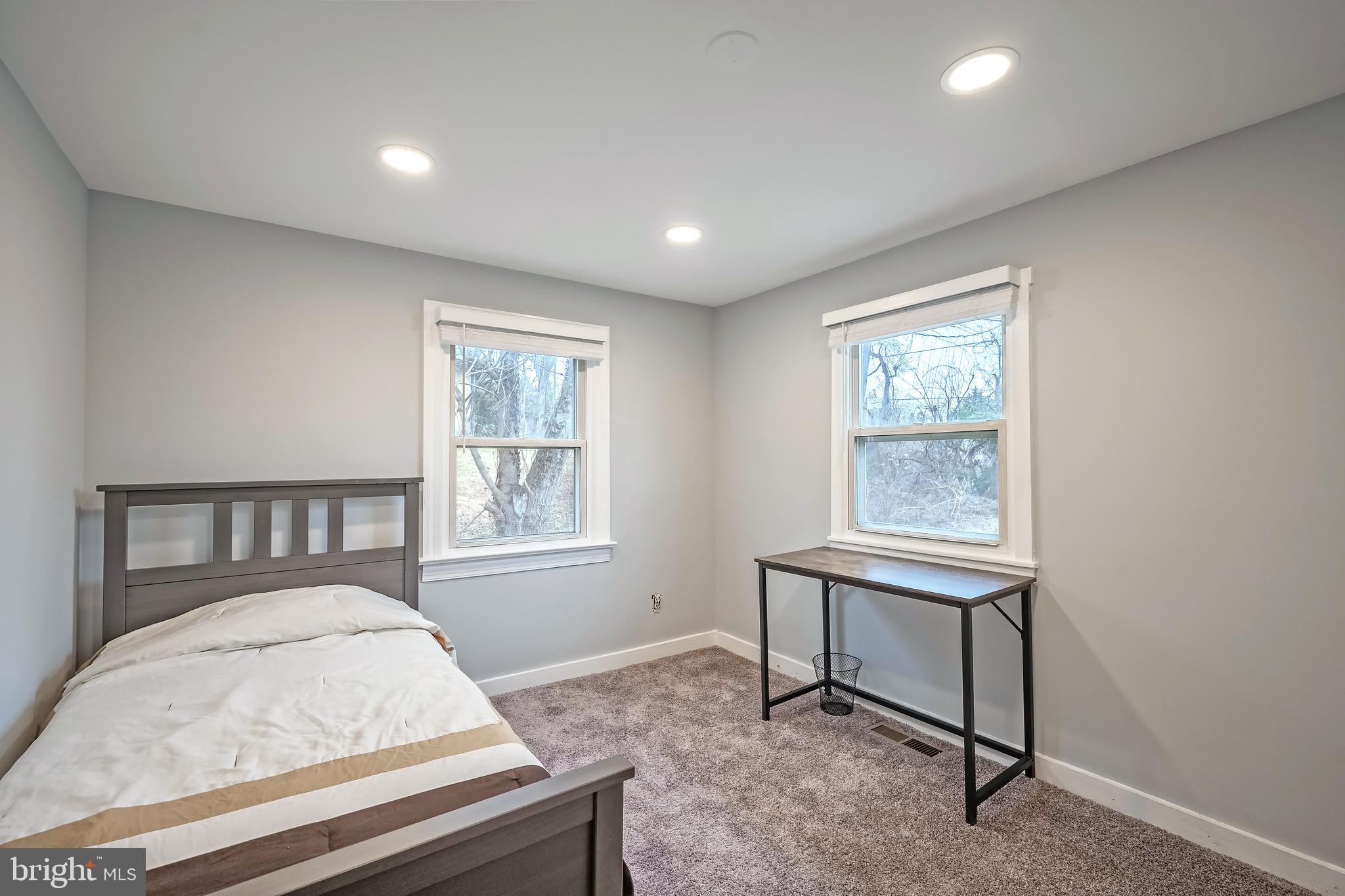6946 Blantyre Road Warrenton, VA 20187 - Photo 10 of 24 a living room with furniture and a window