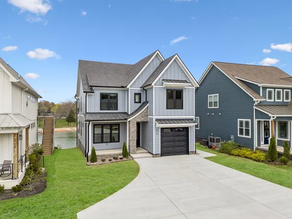 an aerial view of a house with a lake view