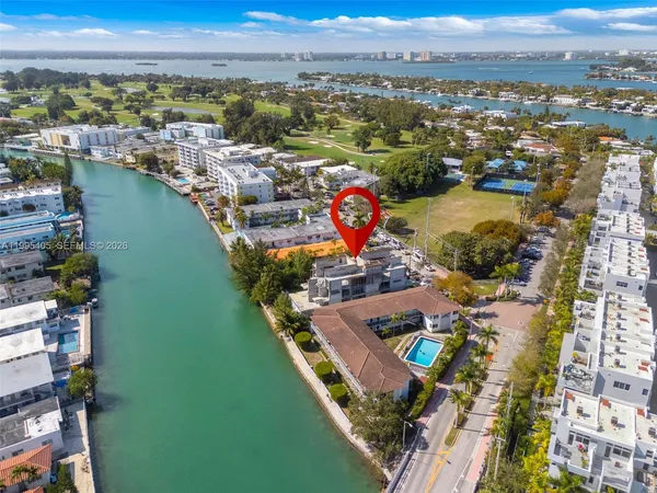 an aerial view of a house with a lake view
