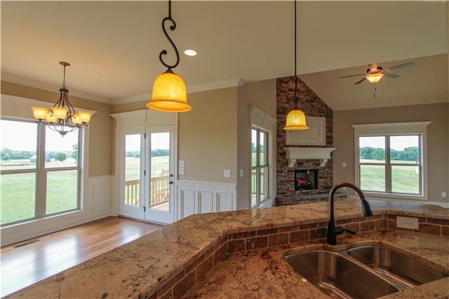 704 Academy Road, Unit 3C Lebanon, TN 37087 - Photo 10 of 20 a kitchen that has a sink stainless steel appliances a window and kitchen view