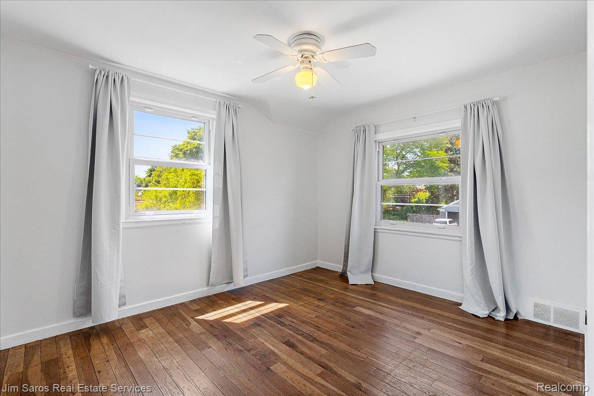 1010 Nottingham Road Grosse Pointe, MI 48230 - Photo 14 of 30 Bright room featuring wood-finish flooring and a ceiling fan with integrated lighting