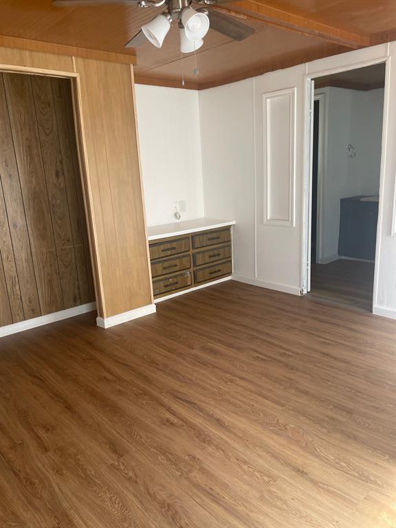 1345 Genoveva Lane Anna, TX 75409 - Photo 2 of 3 an empty room with wooden floor and fireplace