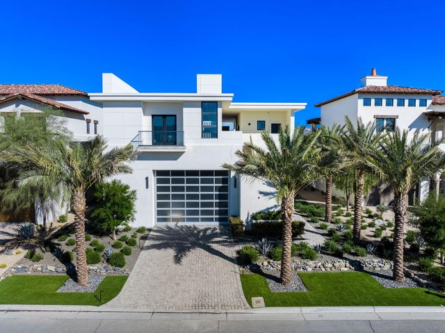 a front view of a house with yard