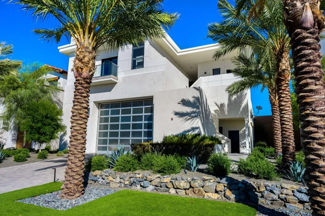 a view of a terrace with furniture and a city view