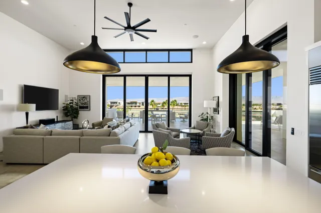 a bedroom with a large bed and a large window