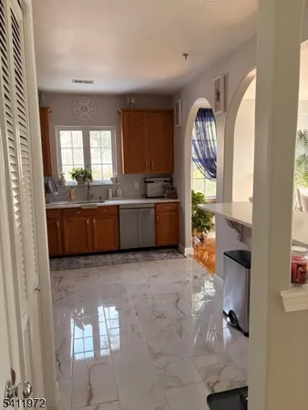 a large hall with cabinets and outdoor view