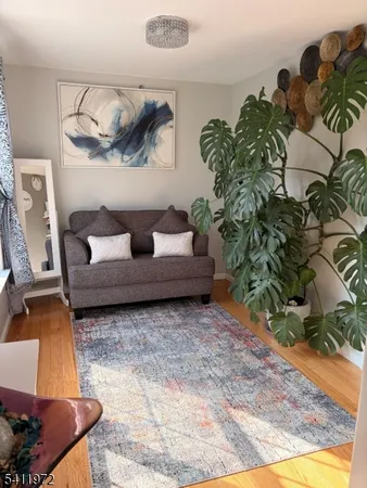 a living room with furniture and a rug