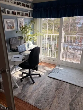 a view of white house with a yard covered in snow