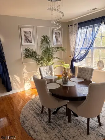 a view of a dining room with furniture and window