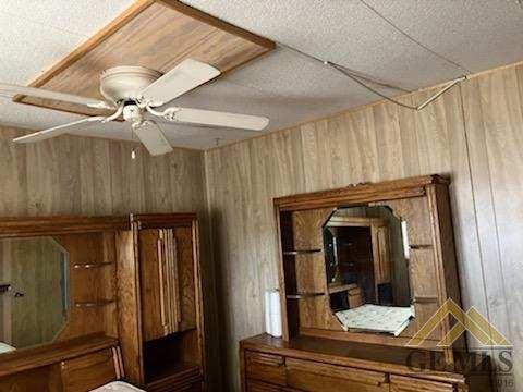 Undisclosed Address Ridgecrest, CA 93555 - Photo 12 of 30 a view of a hallway with a dining table and chairs