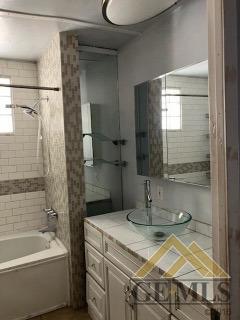 Undisclosed Address Ridgecrest, CA 93555 - Photo 13 of 30 a bathroom with a granite countertop sink a toilet and bathtub