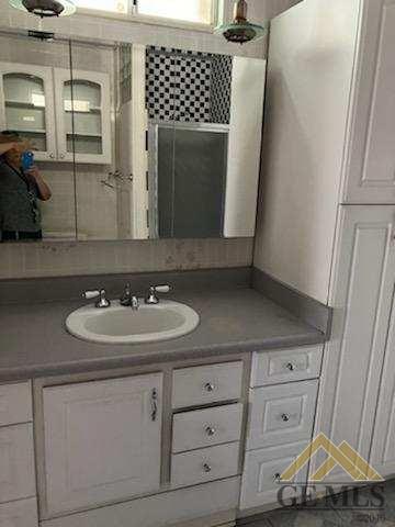 Undisclosed Address Ridgecrest, CA 93555 - Photo 18 of 30 a bathroom with a sink and a mirror