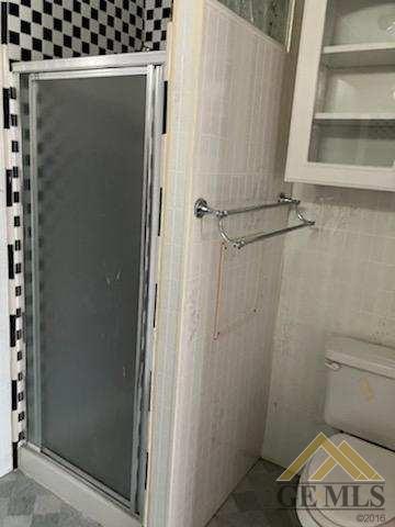Undisclosed Address Ridgecrest, CA 93555 - Photo 19 of 30 a bathroom with a toilet and a shower