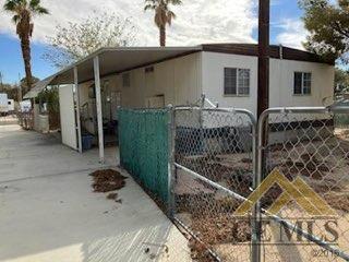 Undisclosed Address Ridgecrest, CA 93555 - Photo 20 of 30 a view of a house with wooden fence