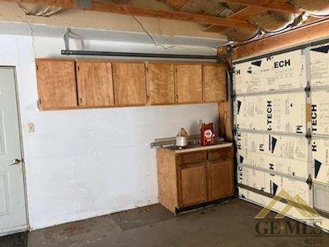 Undisclosed Address Ridgecrest, CA 93555 - Photo 25 of 30 a kitchen with stainless steel appliances a stove and a refrigerator