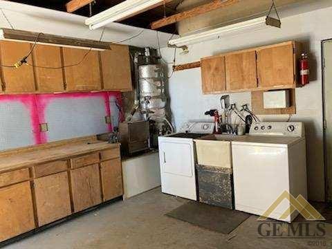 Undisclosed Address Ridgecrest, CA 93555 - Photo 26 of 30 a utility room with cabinets washer and dryer