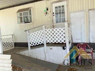 Undisclosed Address Ridgecrest, CA 93555 - Photo 4 of 30 a bedroom with a bed and wooden floor