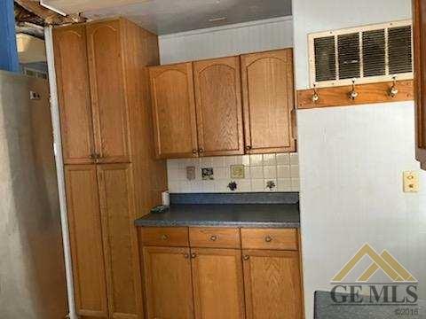 Undisclosed Address Ridgecrest, CA 93555 - Photo 5 of 30 a view of a refrigerator and window
