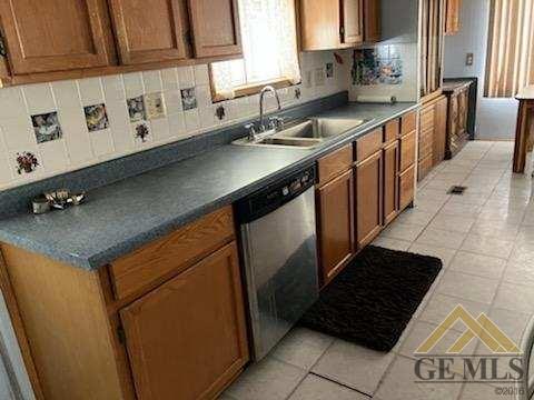 Undisclosed Address Ridgecrest, CA 93555 - Photo 7 of 30 a kitchen with stainless steel appliances granite countertop a sink stove and cabinets