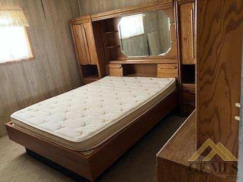 Undisclosed Address Ridgecrest, CA 93555 - Photo 10 of 30 a bed sitting in a bedroom next to a window