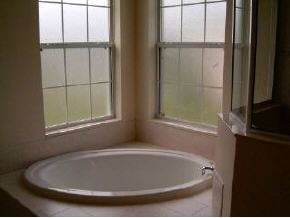 975 Southeast Cloverleaf Palm Bay, FL 32909 - Photo 4 of 6 a bathroom with a tub