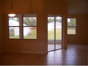 975 Southeast Cloverleaf Palm Bay, FL 32909 - Photo 5 of 6 a view of an empty room with a window