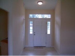 975 Southeast Cloverleaf Palm Bay, FL 32909 - Photo 6 of 6 wooden floor and window in a room