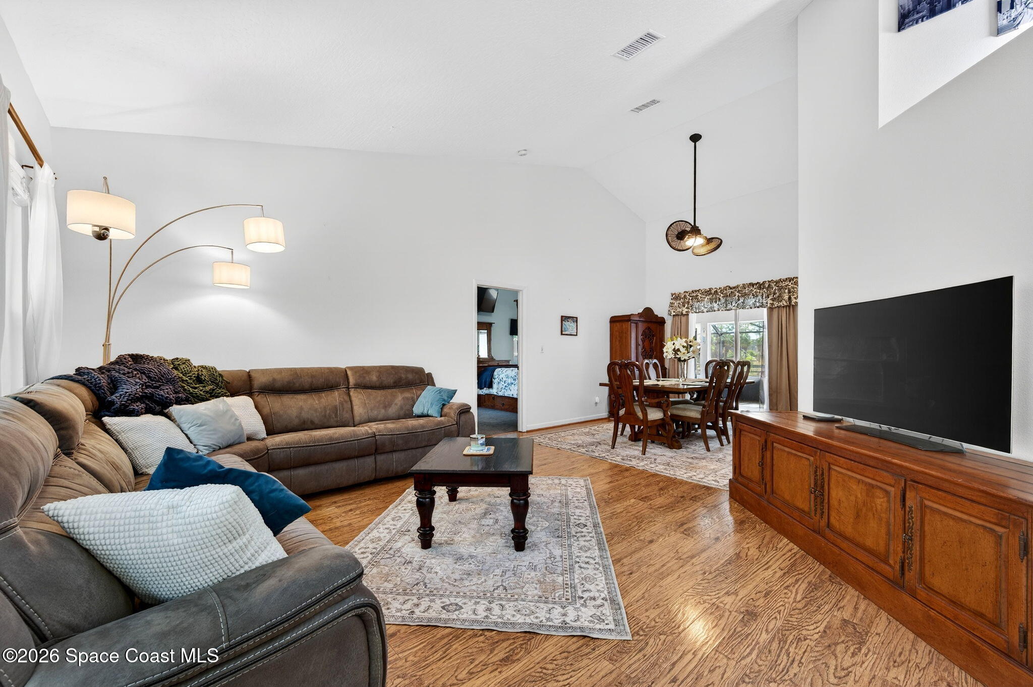 239 Deer Run Road Palm Bay, FL 32909 - Photo 12 of 46 239 Deer Run Rd Living Room to Dining Ro