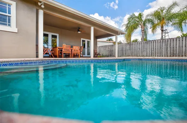 a view of swimming pool from a balcony