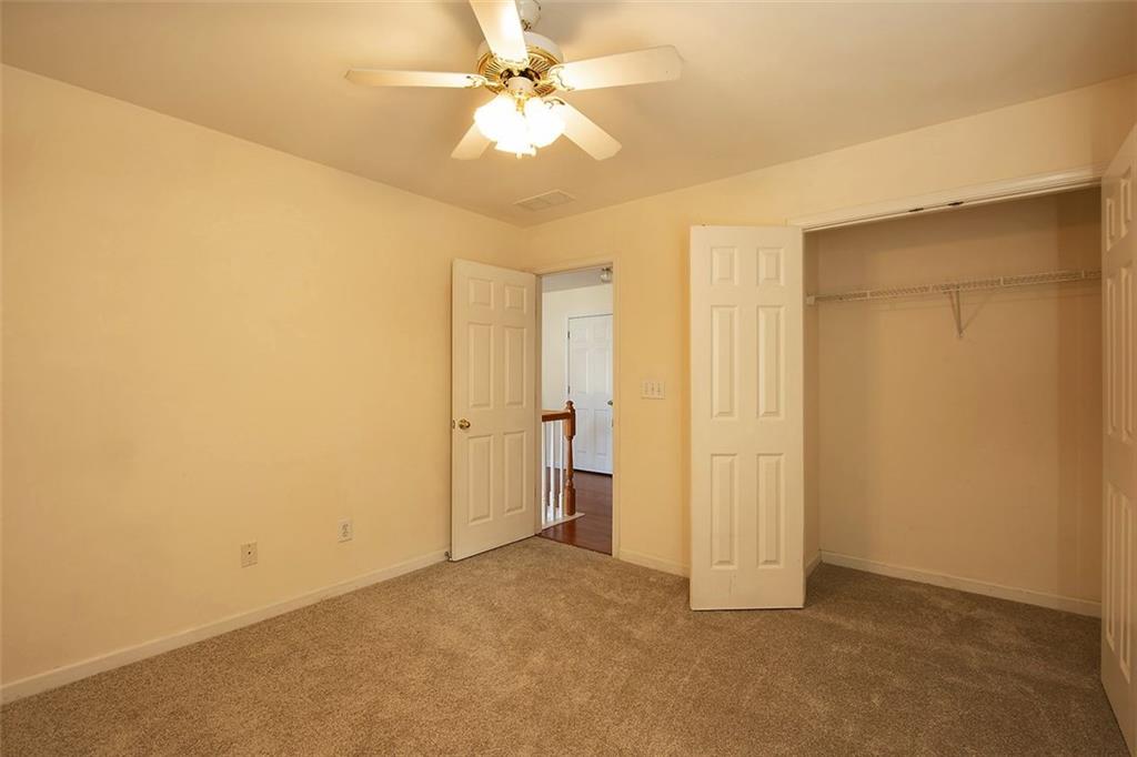12755 Morningpark Circle Alpharetta, GA 30004 - Photo 32 of 36 a view of empty room with a ceiling fan
