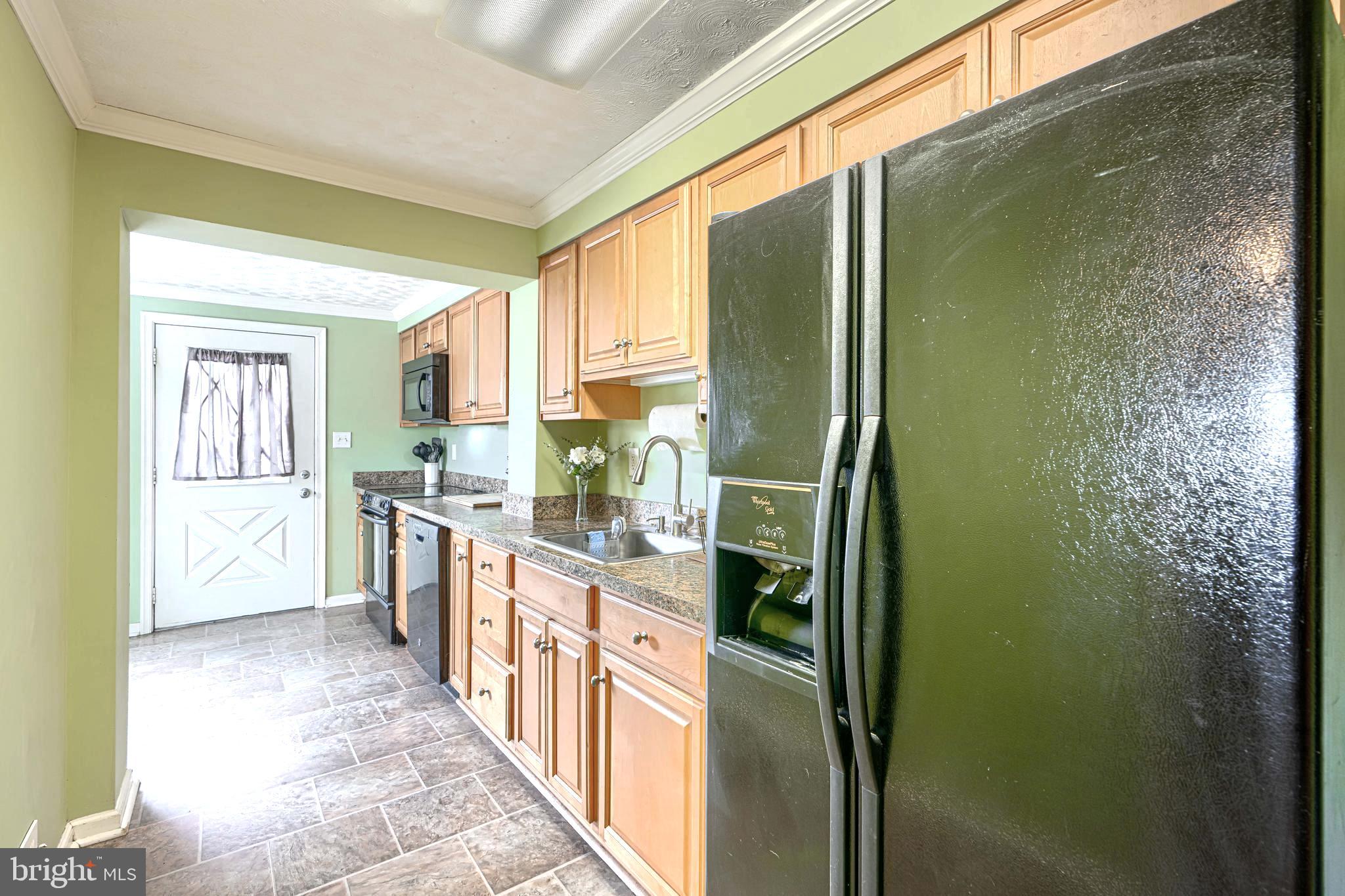 2829 Creston Road Baltimore, MD 21222 - Photo 12 of 44 Kitchen w/Wall of Cabinetry!