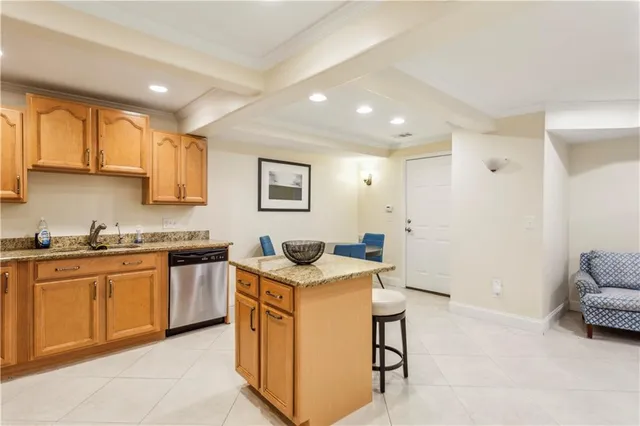 a kitchen with stainless steel appliances granite countertop a sink stove and cabinets