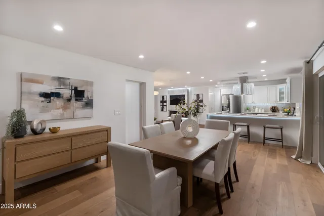 a bedroom with a bed and a potted plant