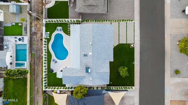 an aerial view of residential houses with city view