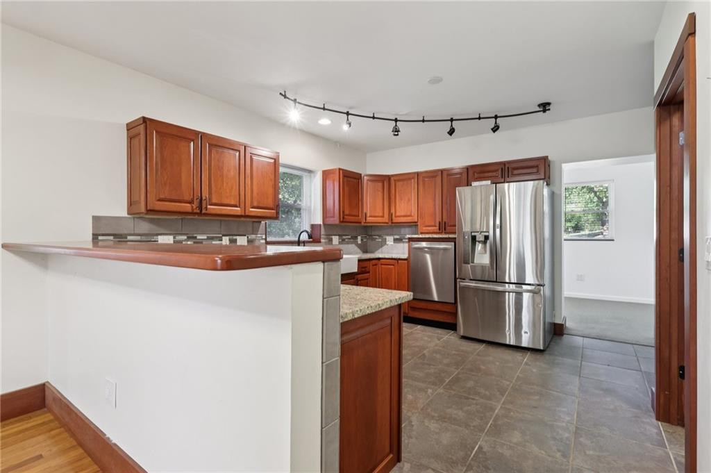 115 Enon Road Darlington, PA 16115 - Photo 12 of 50 a kitchen with stainless steel appliances granite countertop a refrigerator stove and a sink
