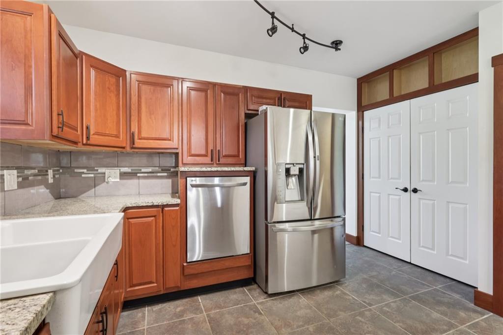 115 Enon Road Darlington, PA 16115 - Photo 13 of 50 a kitchen with stainless steel appliances granite countertop a refrigerator a sink and cabinets