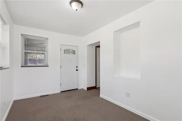 an empty room with windows