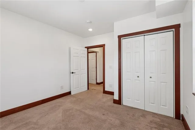 an empty room with closet area