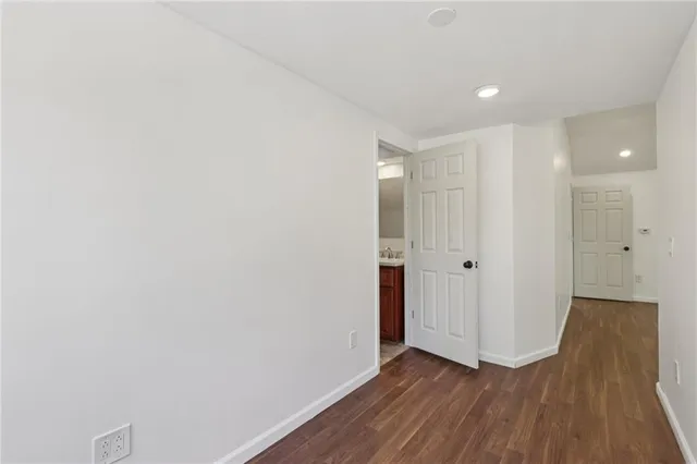 a view of hallway with wooden floor