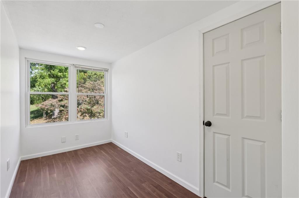 115 Enon Road Darlington, PA 16115 - Photo 27 of 50 an empty room with wooden floor and windows