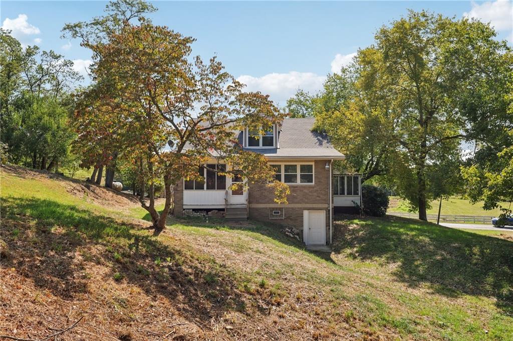 115 Enon Road Darlington, PA 16115 - Photo 4 of 50 a front view of a house with a yard