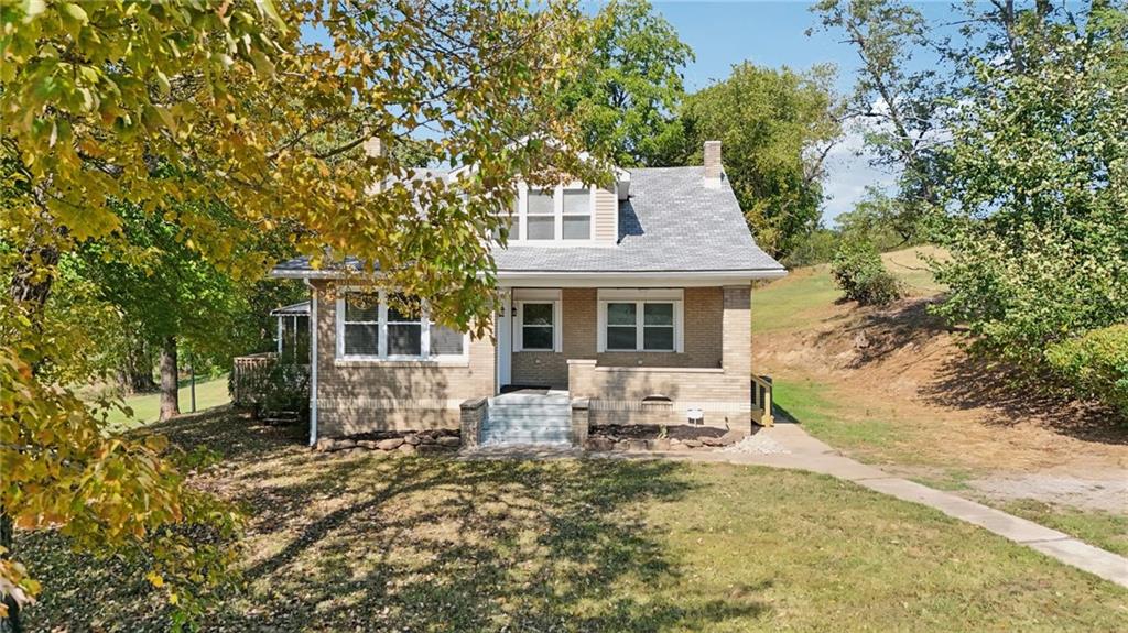 115 Enon Road Darlington, PA 16115 - Photo 47 of 50 a front view of a house with garden