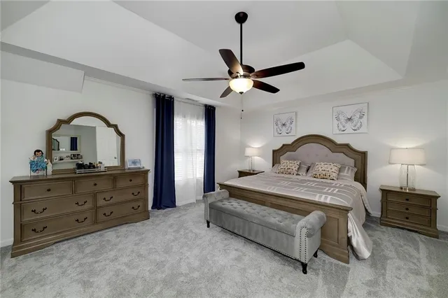 a kitchen with granite countertop kitchen island wooden cabinets and refrigerator