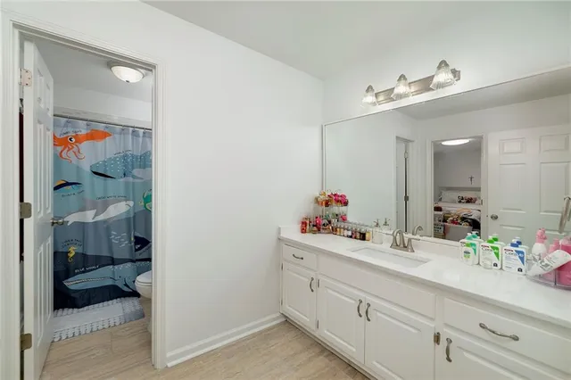 a view of a house with a yard and a garage