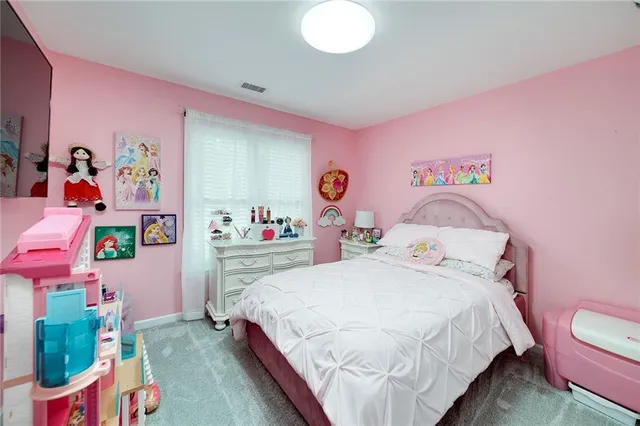 an aerial view of a house with outdoor space swimming pool