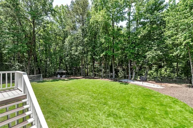 a view of a chair and table in the garden